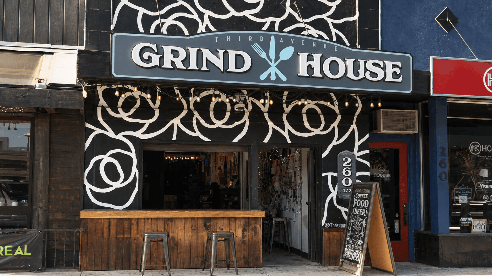 The rose-covered Grind House coffee shop storefront on Third Avenue